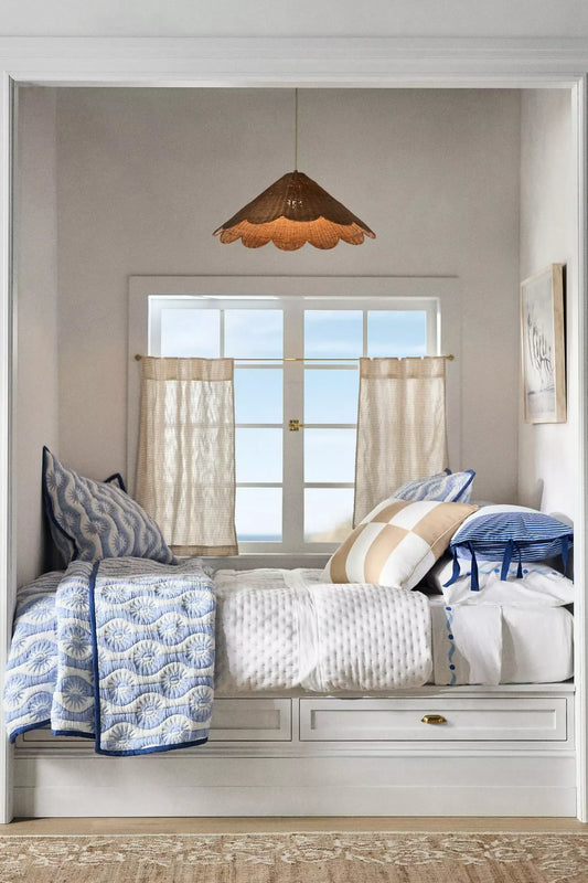 Maude Scallop Rattan Pendant Light over Coastal Bedroom