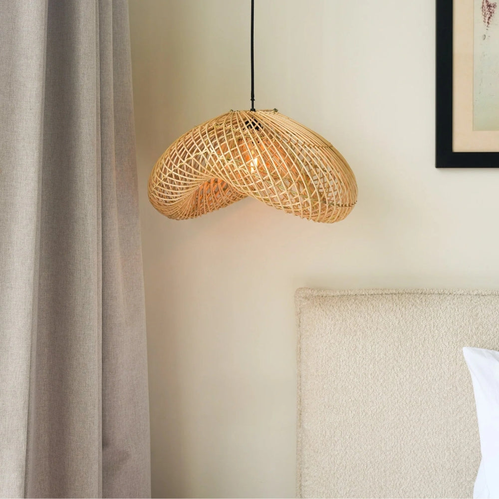 rattan wave pendant light beside the bed