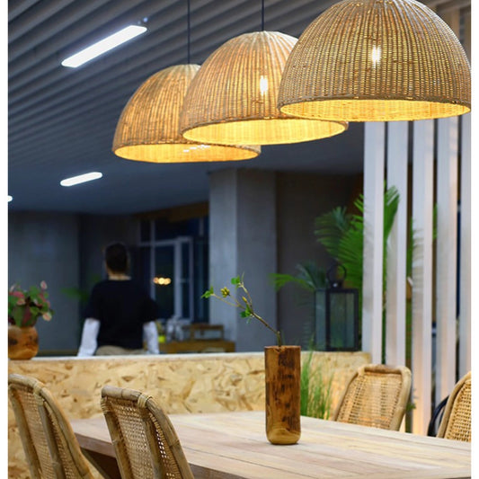 Set of three THAELY White Rattan Wicker Pendant Lights over a Dining Table