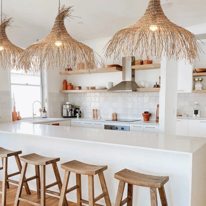 Three Pipa Coastal Tassel Rattan Pendant Lights over Kitchen Island