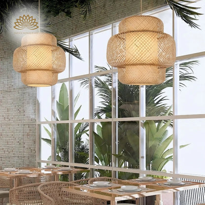 Two large Enakshi Bamboo woven pendant lights in a bright, modern dining area