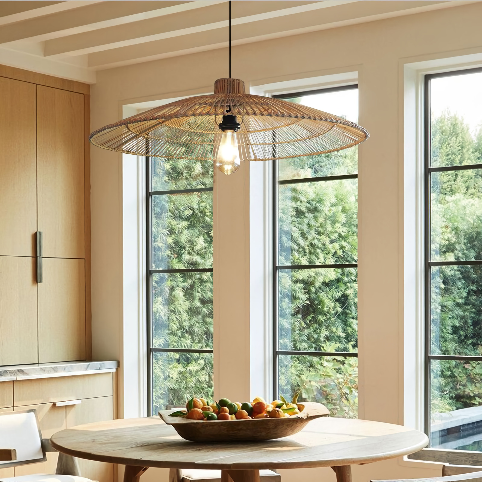 Umbrella Rattan Round Pendant Light hangs over Boho Wooden table